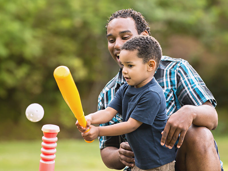 Father and son playing baseball