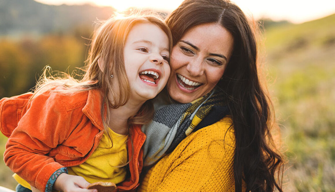 Mother and daughter laughing