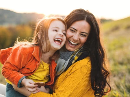 Mother and daughter laughing