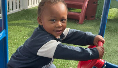 Young boy playing outside